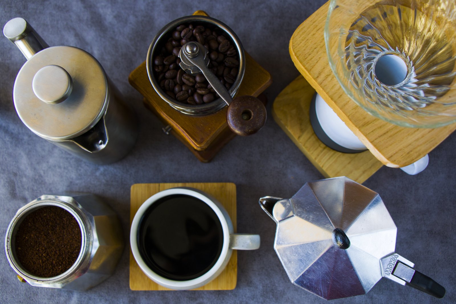 top view of coffee makers grinder and a cup of c 2023 11 27 04 56 31 utc